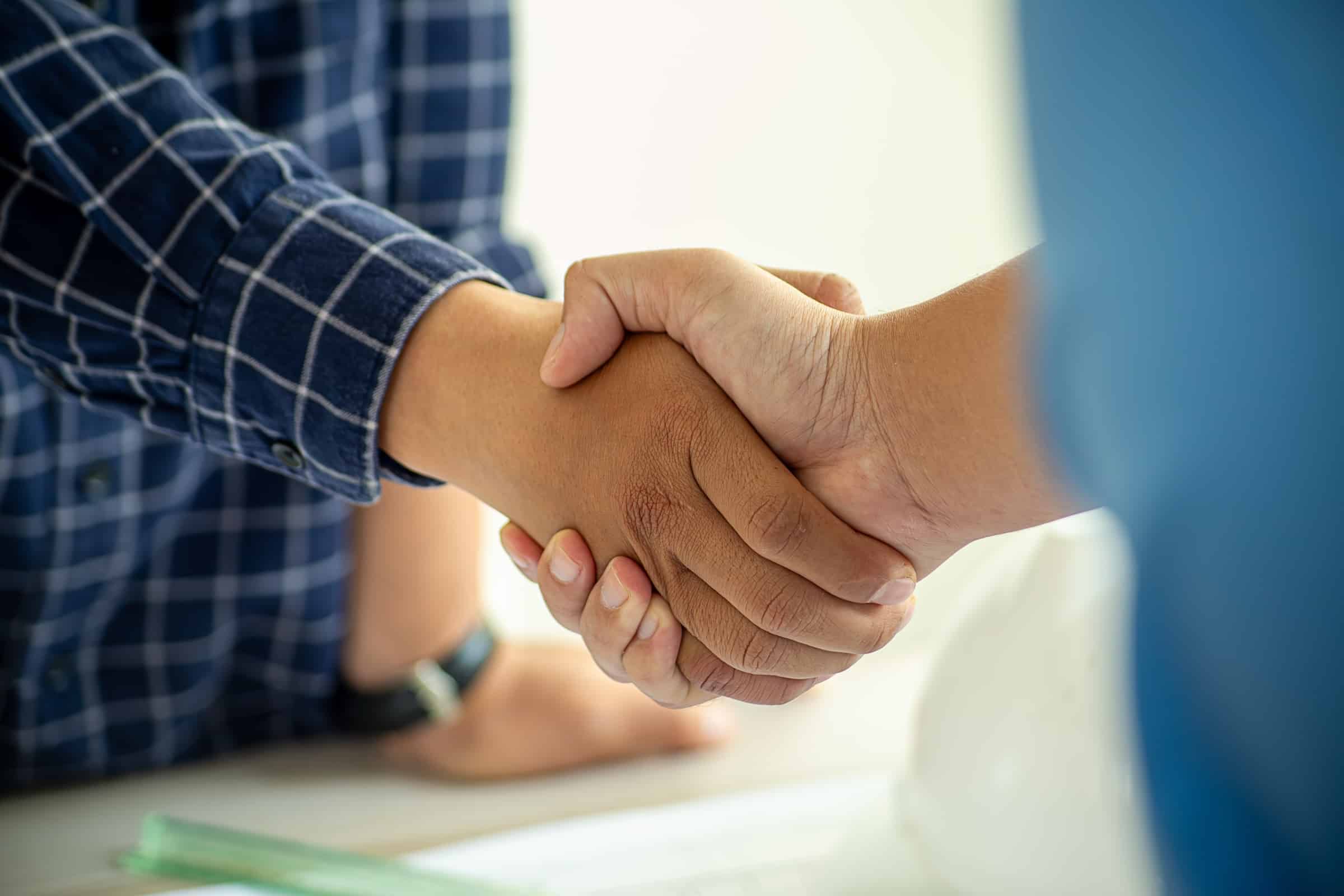 Contractor shaking hands with customer